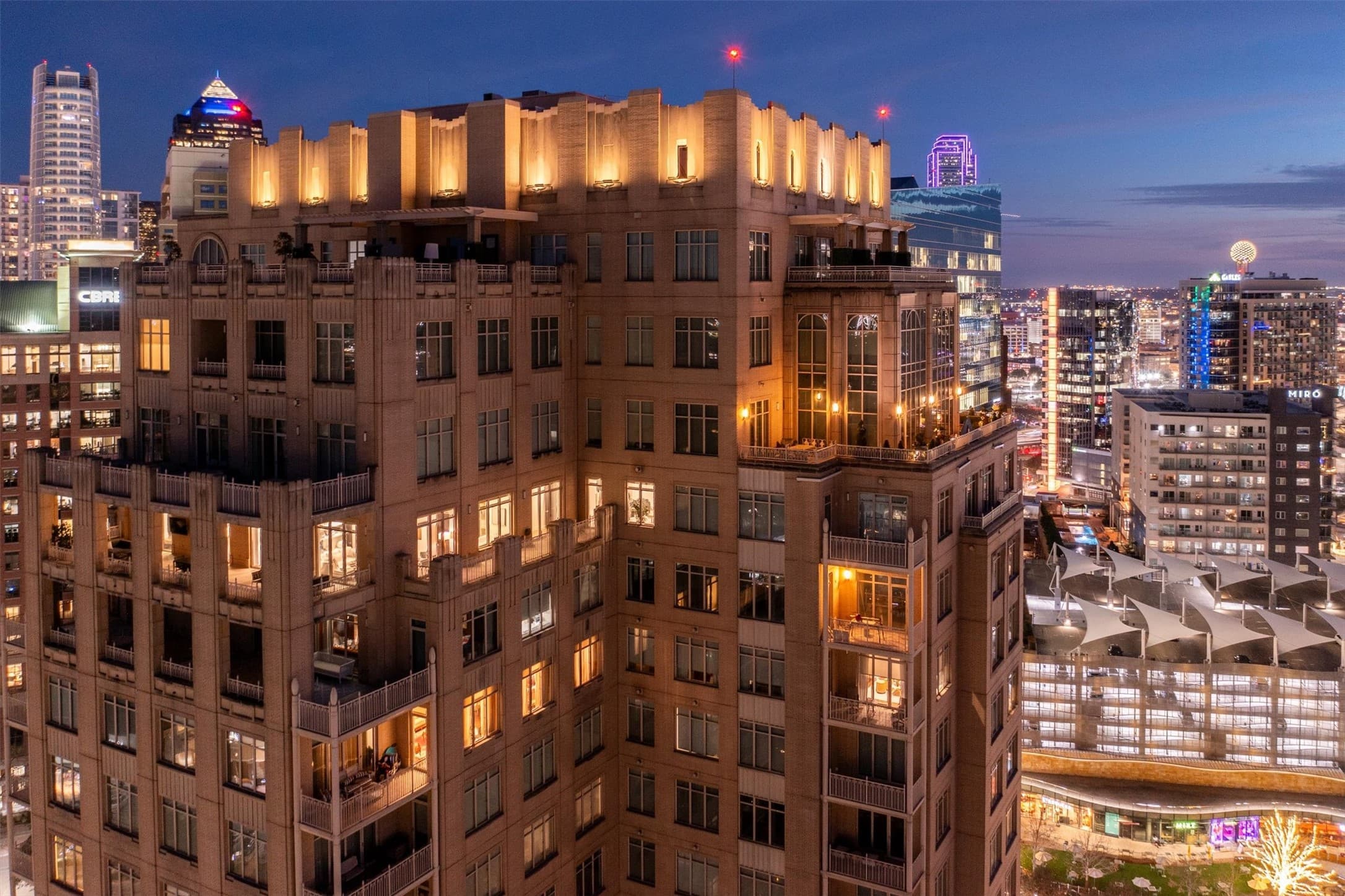 Ritz Carlton Residences Dallas high-rise at dusk with city skyline